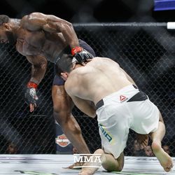 Demian Maia tries to take down Tyron Woodley at UFC 214.