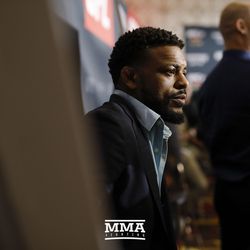 Michael Johnson listens to a question at UFC 213 media day.