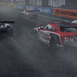 A Nissan GT-R GT3 and a McLaren 650S GT3 in the rain at Fuji Speedway.