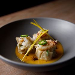 Dungeness crab dumplings with smoked ham hock and black bean