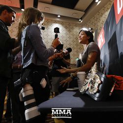 Amanda Nunes answers a question at UFC 213 media day.