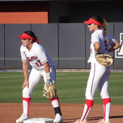 Mo Mercado and Reyna Carranco wait for a throw down from the catcher