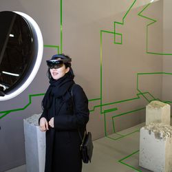 Visitors wear HoloLens VR glasses to view Studio Drift’s piece, <em>Concrete Storm.</em>