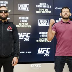 Jeremy Stephens and Gilbert Melendez face the crowd at UFC 215 media day at the Rogers Place in Edmonton, Alberta, Canada.