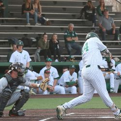 The Eastern Michigan player digging the pitch out.<br>