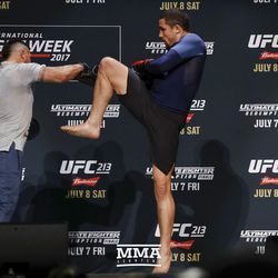 Robert Whittaker throws a knee during UFC 213 open workouts Wednesday at the Park Theater in Las Vegas, Nevada.