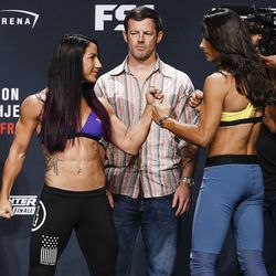 Tecia Torres and Juliana Lima face off at the TUF 25 Finale ceremonial weigh-ins Thursday at Park Theater in Las Vegas.