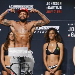 Michael Johnson hits the scale at the TUF 25 Finale ceremonial weigh-ins Thursday at Park Theater in Las Vegas.