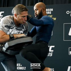 Demetrious Johnson lands a knee at UFC 215 open workouts at the Rogers Place in Edmonton, Alberta, Canada.