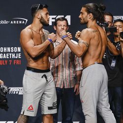 Brad Tavares and Elias Theodorou face off at the TUF 25 Finale ceremonial weigh-ins Thursday at Park Theater in Las Vegas.