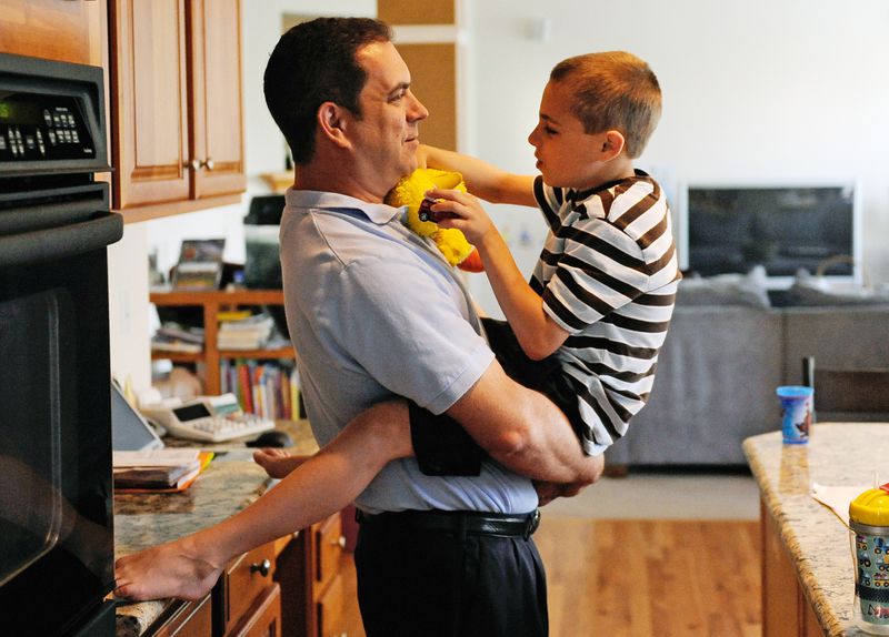 Seven-year-old Connor talks to his father David Bukovinsky as they get ready to start their day.