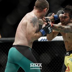 Neil Seery and Alexandre Pantoja trade punches at UFC Fight Night 113 on Sunday at the The SSE Hydro in Glasgow, Scotland.