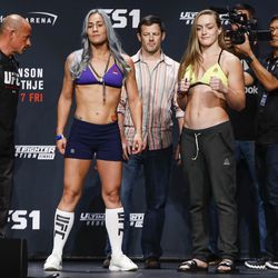 Jessica Eye and Aspen Ladd face the crowd at the TUF 25 Finale ceremonial weigh-ins Thursday at Park Theater in Las Vegas.