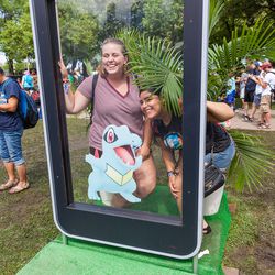 Attendees posing with a Totodile