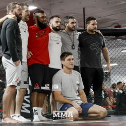 Demian Maia takes a picture with his team.