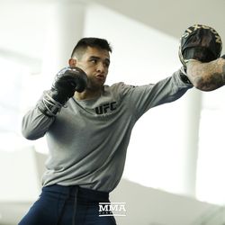 Ray Borg hits pads during the UFC 216 open workouts Thursday at T-Mobile Arena in Las Vegas.
