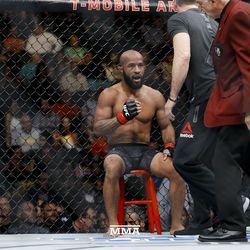Demetrious Johnson gets some advice between rounds.