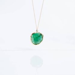 Kathryn Bentley <a href="https://www.wilderlife.com/kathryn-bentley-fine-jewelry-emerald-organic-amule.html">Emerald Organic Amulet</a>, $1,300