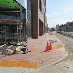 New paving, alongside plaza building, east side of Clark Street