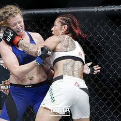 Cris Cyborg smacks Tonya Evinger at UFC 214.