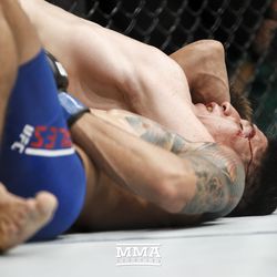 Brett Johns tries to lock up a choke on Albert Morales at UFC Fight Night 113 on Sunday at the The SSE Hydro in Glasgow, Scotland.
