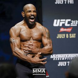 Yoel Romero shows off his guns during UFC 213 open workouts Wednesday at the Park Theater in Las Vegas, Nevada.
