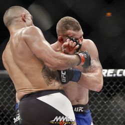 Vitor Belfort punches Nate Marquardt at UFC 212.