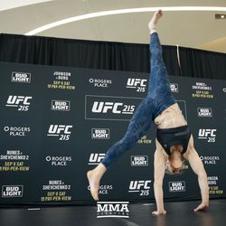 Valentina Shevchenko does a cartwheel at UFC 215 open workouts at the Rogers Place in Edmonton, Alberta, Canada.