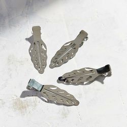 Urban Outfitters <a href="http://www.urbanoutfitters.com/urban/catalog/productdetail.jsp?id=38669602&category=GIFTS-UNDER12">Hair Clip Set</a>, $8