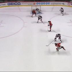Screen #4 - 12/1 - As Hjarmalsson fires a wrister, there’s four skaters between him and Schneider.  Quincey is the one in white right in the goalie’s way.
