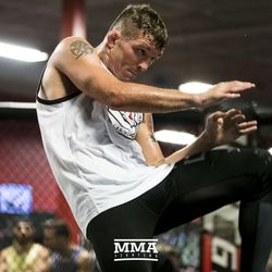 Darren Elkins throws a knee at UFC on FOX 25 open workouts Thursday at UFC Gym in New Hyde Park, N.Y.