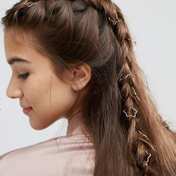 ASOS <a href="http://us.asos.com/asos/asos-pack-of-20-star-hair-rings/prd/7344775?iid=7344775&clr=Gold&SearchQuery=&cid=4174&pgesize=204&pge=0&totalstyles=245&gridsize=3&gridrow=12&gridcolumn=2">Pack of 20 Star Hair Rings</a> ($8)