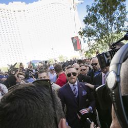 Conor McGregor walks during arrival event Tuesday.