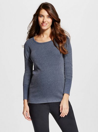 A model wearing a Target maternity top and leggings