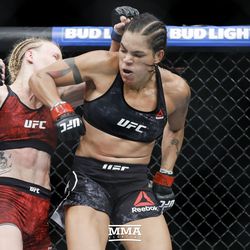 Amanda Nunes catches Valentina Shevchenko with an elbow at UFC 215.