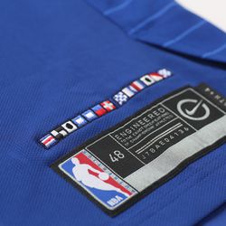 View of the jock tag on the Clippers’ new blue “Icon edition” jersey designed by Nike.  The flags spell “Clipper Nation” in the nautical alphabet.