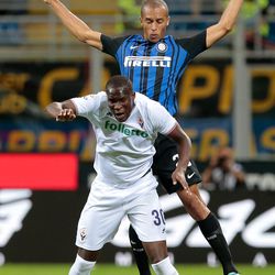 Joao Miranda de Souza Filho of FC Internazionale Milano jumps for the ball with Khouma Babacar of ACF Fiorentina (front) during the Serie A match between FC Internazionale and ACF Fiorentina at Stadio Giuseppe Meazza on August 20, 2017 in Milan, Italy.