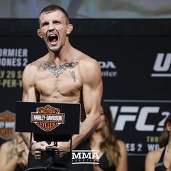 Jason Knight poses at UFC 214 weigh-ins.