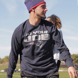 Fagundez looks into the distance while training in his Patriots t-shirt.
