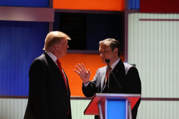 Ted Cruz and Donald Trump talk during a commercial break.
