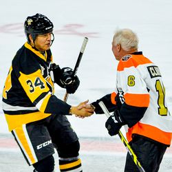 Ted Nolan and Bobby Clarke shaking hands after the game