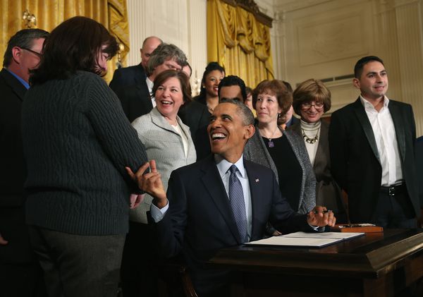 Obama signing the new regulations in 2014.