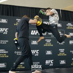 Ray Borg hits a jumping knee at UFC 215 open workouts at the Rogers Place in Edmonton, Alberta, Canada.