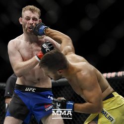Daniel Teymur punches Danny Henry at UFC Fight Night 113 on Sunday at the The SSE Hydro in Glasgow, Scotland.