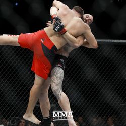 Travis Browne looks for the takedown at UFC 213.