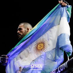 Santiago Ponzinibbio raises his flag at UFC Fight Night 113 on Sunday at the The SSE Hydro in Glasgow, Scotland.