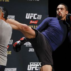 Robert Whittaker kicks high during UFC 213 open workouts Wednesday at the Park Theater in Las Vegas, Nevada.
