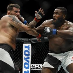 Justin Willis (right) trades punches with James Mulheron at UFC Fight Night 113 on Sunday at the The SSE Hydro in Glasgow, Scotland.