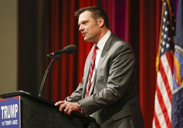 Kris Kobach speaks at a Trump campaign rally.