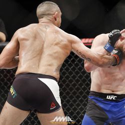 Vitor Belfort punches Nate Marquardt at UFC 212.